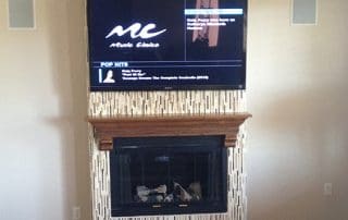 floating tv over fireplace